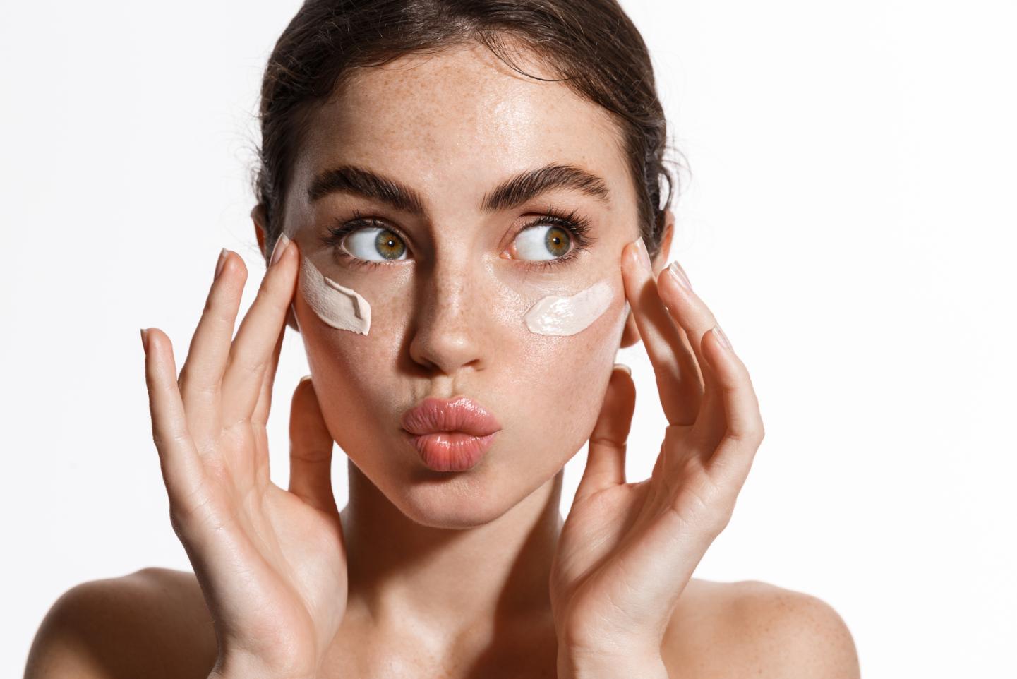 Woman applying cream after Botox treatment