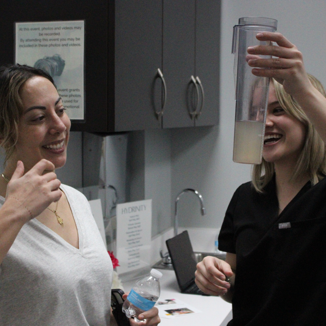 Radiance Rx Pittsboro location Grand Opening event page_picture of patient and medical aesthetician interacting following procedure