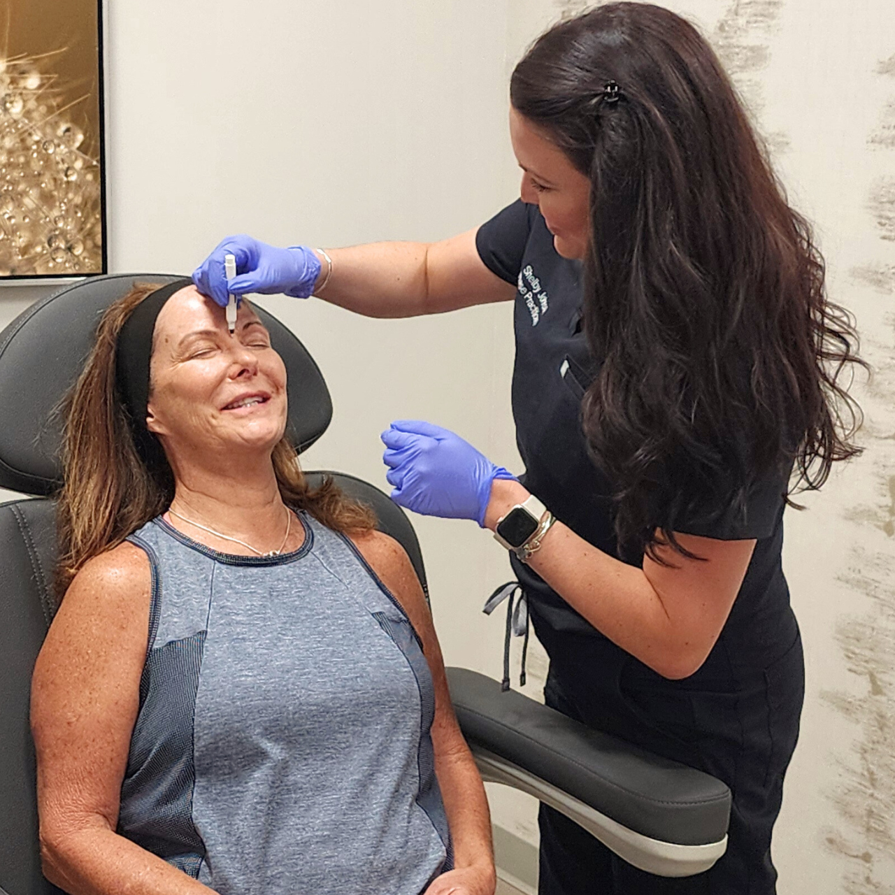 Radiance Rx Skin & Aesthetics provider performing live demonstration on patient at event